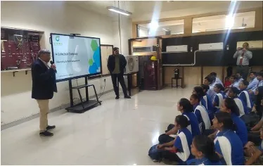 A MindMints speaker addressing ICICI Foundation trainees seated on the floor during an awareness session